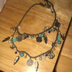 Layer necklace with feathers, cross, pearls